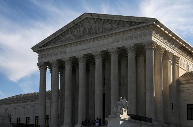 People visit the U.S. Supreme Court building in Washington, U.S. March 15, 2022. REUTERS/Emily Elconin