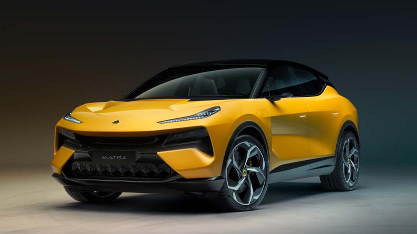 The Eletre 'Hyper-SUV' in dark yellow photographed in an empty space.