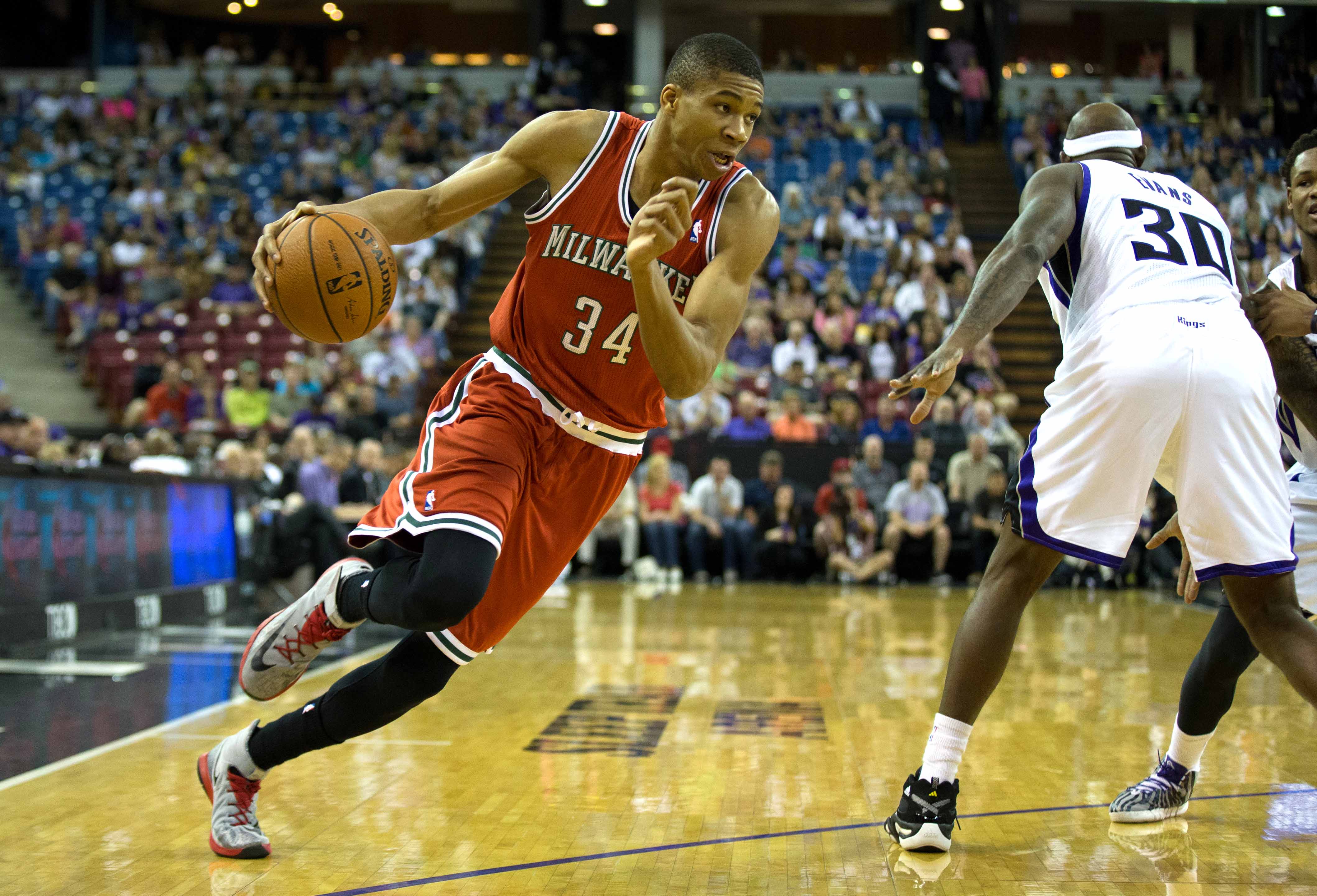 Bucks' Giannis Antetokounmpo just keeps growing, is now 'almost' 6-foot-11