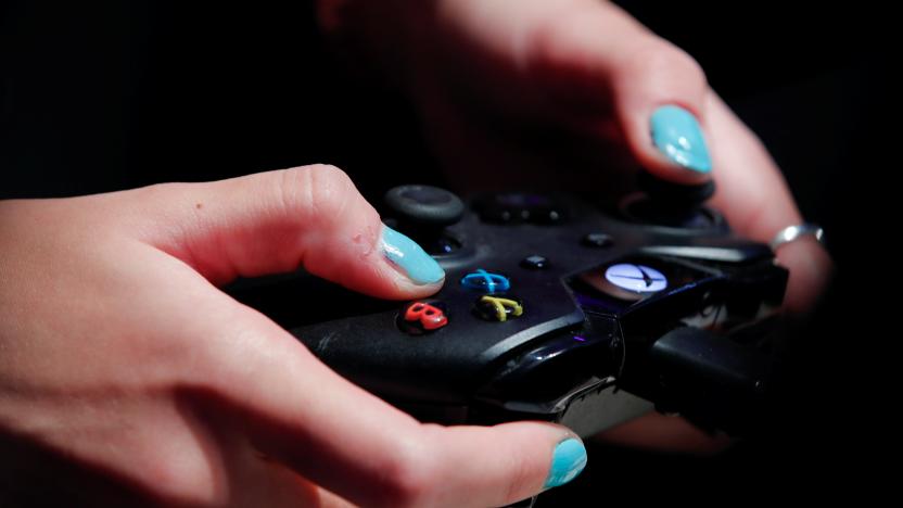 A female gamer uses an XBox One game controller to play Need for Speed, at the world's largest computer games fair, Gamescom, in Cologne, Germany August 23, 2017. REUTERS/Wolfgang Rattay