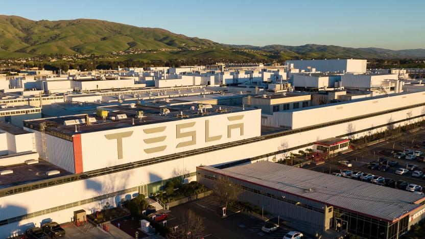 An aerial view shows the Tesla Fremont Factory in Fremont, California on February 10, 2022. - Tesla can hardly make enough electric vehicles to meet booming demand, but behind the world's most valuable auto brand is its troubled California factory that makes most of those cars. The Fremont plant near San Francisco has seen a spate of sexual harassment lawsuits, years of racism allegations -- including a California civil rights agency complaint this week -- and even a murder last year (Photo by JOSH EDELSON / AFP) (Photo by JOSH EDELSON/AFP via Getty Images)