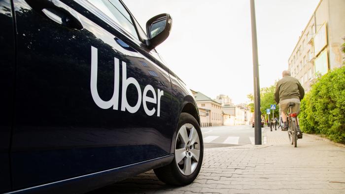 Warsaw, Poland  - April 30, 2019: View on Uber car (Skoda) with inscription on the street before sunset