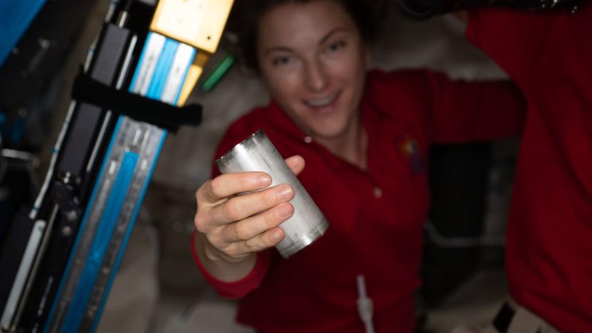 NASA astronaut Kayla Barron replaces a filter in the space station’s Brine Processor Assembly.