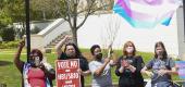 Opponents of state bills targeting transgender youth protesting at the Alabama State House. (Julie Bennett/Getty Images)