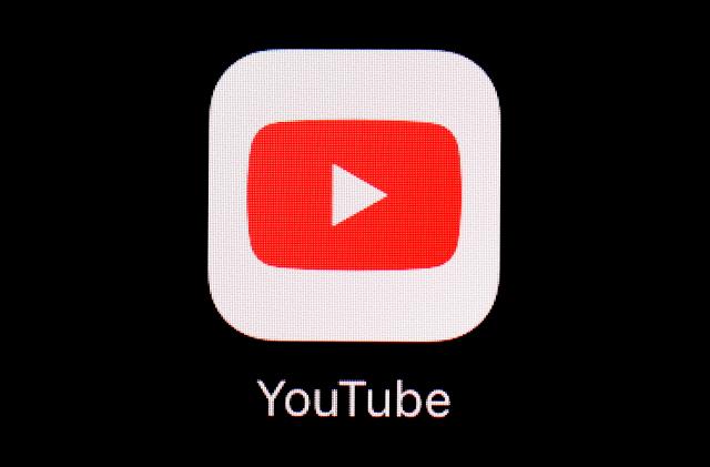 FILE - The YouTube app is displayed on an iPad in Baltimore. Police said Wednesday, Jan. 31, 2024, that they charged Justin Mohn, 32, with first-degree murder and abusing a corpse after he beheaded his father, Michael, in their Bucks County, Pa., home and publicized it in a 14-minute YouTube video that anyone, anywhere could see. (AP Photo/Patrick Semansky, File)