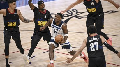 Getty Images - DENVER, CO - MAY 6: Anthony Edwards (5) of the Minnesota Timberwolves drives between Michael Porter Jr. (1), Kentavious Caldwell-Pope (5), Jamal Murray (27) and Nikola Jokic (15) of the Denver Nuggets during the first quarter at Ball Arena in Denver on Monday, May 6, 2024. (Photo by AAron Ontiveroz/The Denver Post)