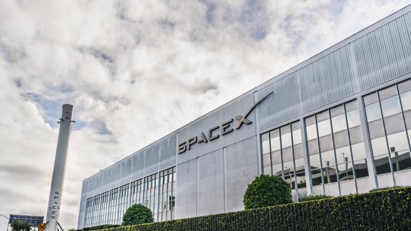 Dec 8, 2019 Hawthorne / Los Angeles / CA / USA - SpaceX (Space Exploration Technologies Corp.) headquarters; Falcon 9 rocket displayed on the left; SpaceX is a private American aerospace manufacturer