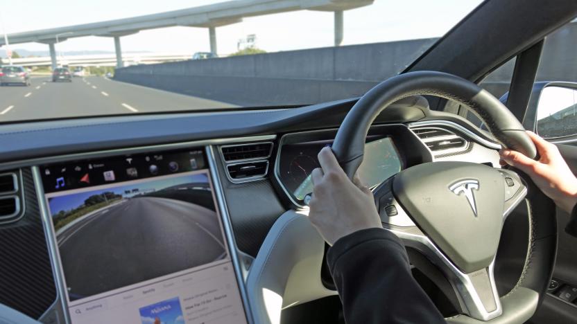 AUCKLAND - AUG 12 2018:Person driving a Tesla plug-in electric car Model X, a luxury, crossover utility vehicle (CUV) , on a motorway. in 2016 seventh among the world's best-selling plug-in cars.