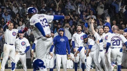 Getty Images - CHICAGO, ILLINOIS - MAY 07: Members of the Chicago Cubs celebrate after Michael Busch #29 hit a walk-off solo home run in the ninth inning to defeat the San Diego Padres at Wrigley Field on May 07, 2024 in Chicago, Illinois. (Photo by Griffin Quinn/Getty Images)