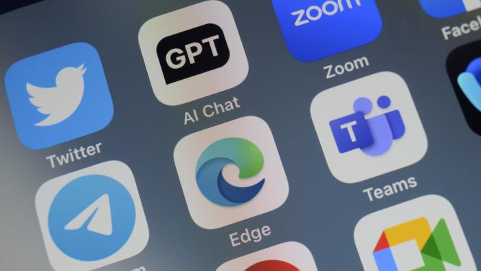 Close-up of of the icon of the Microsoft Edge artificial intelligence Internet browser app logo on a cellphone screen. Surrounded by the app icons of Twitter, ChatGPT, Zoom, Telegram, Teams, Chrome and Meet.