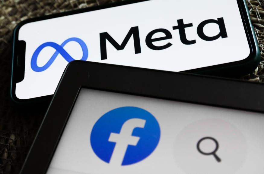 Meta logo displayed on a phone screen and Facebook icon displayed on a laptop screen are seen in this illustration photo taken in Krakow, Poland on October 29, 2021. (Photo by Jakub Porzycki/NurPhoto via Getty Images)