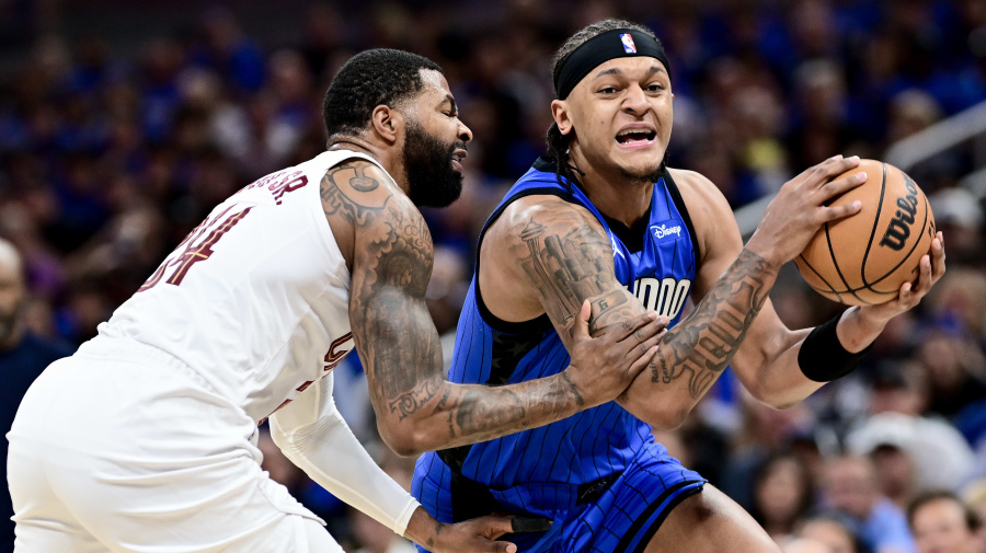 Getty Images - ORLANDO, FLORIDA - MAY 03: Paolo Banchero #5 of the Orlando Magic drives to the basket against Marcus Morris Sr. NOTE TO USER: User expressly acknowledges and agrees that, by downloading and/or using this Photograph, user is consenting to the terms and conditions of the Getty Images License Agreement. #24 of the Cleveland Cavaliers during the first quarter in Game Six of the Eastern Conference First Round Playoffs at Kia Center on May 03, 2024 in Orlando, Florida. NOTE TO USER: User expressly acknowledges and agrees that, by downloading and/or using this Photograph, user is consenting to the terms and conditions of the Getty Images License Agreement.  (Photo by Julio Aguilar/Getty Images)