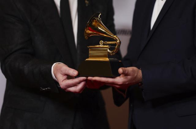 Michael Romanowski and Charlie Post pose with the Grammy for Best Classical Engineered Album for "Bates: Philharmonia Fantastique - The Making Of The Orchestra" during the Premiere Ceremony of the 65th Annual Grammy Awards in Los Angeles, California, U.S., February 5, 2023. REUTERS/Mike Blake - HP1EJ2601R891