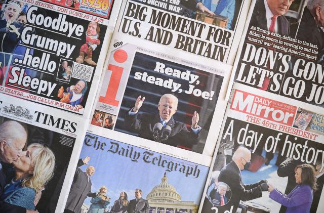 LONDON, ENGLAND - JANUARY 21: A selection of the UK newspaper front pages show images from the inauguration of President Biden, on January 21, 2021 in London, England. As the United Kingdom faces a future outside of the EU, the relationship with the new US administration is set to play a large part in its development over coming years. (Photo by Leon Neal/Getty Images)