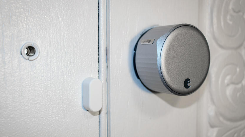 August Smart Lock on a white door.