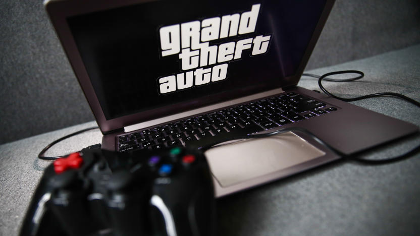 Grand Theft Auto logo displayed on a laptop screen and a gamepad are seen in this illustration photo taken in Krakow, Poland on September 21, 2021. (Photo by Jakub Porzycki/NurPhoto via Getty Images)