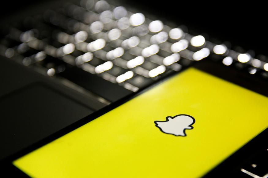 ISTANBUL, TURKEY - FEBRUARY 24: In this photo illustration a mobile phone screen displays the Snapchat logo in front of a keyboard in Istanbul, Turkey on February 24, 2020. Muhammed Enes Yildirim / Anadolu Agency