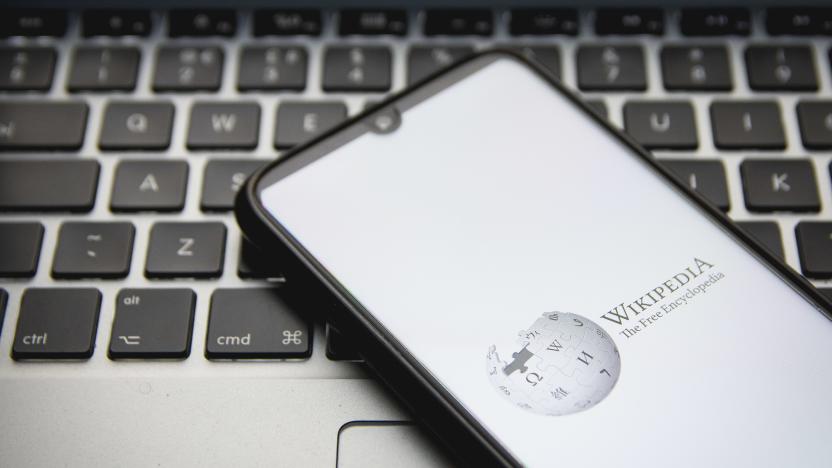 In this photo illustration a Wikipedia logo seen displayed on a smartphone screen with a computer keyword in the background in Athens, Greece on December 12, 2021. (Photo by Nikolas Kokovlis/NurPhoto via Getty Images)