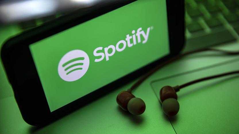 TURKEY - 2021/12/02: In this photo illustration the Spotify logo seen displayed on a smartphone screen near a pair of earphones. (Photo Illustration by Onur Dogman/SOPA Images/LightRocket via Getty Images)