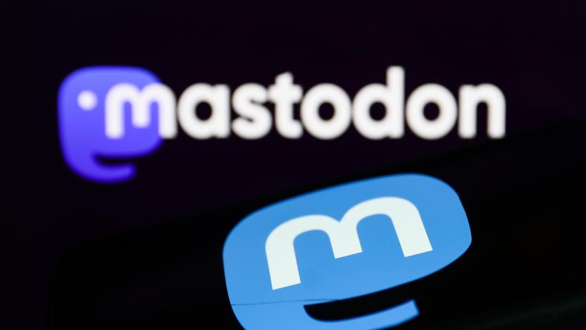 Mastodon logo displayed on a phone screen and Mastodon website logo displayed on a screen in the background are seen in this illustration photo taken in Krakow, Poland on November 5, 2022. (Photo by Jakub Porzycki/NurPhoto via Getty Images)