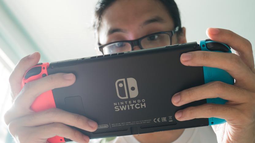 A man playing Nintendo Switch.