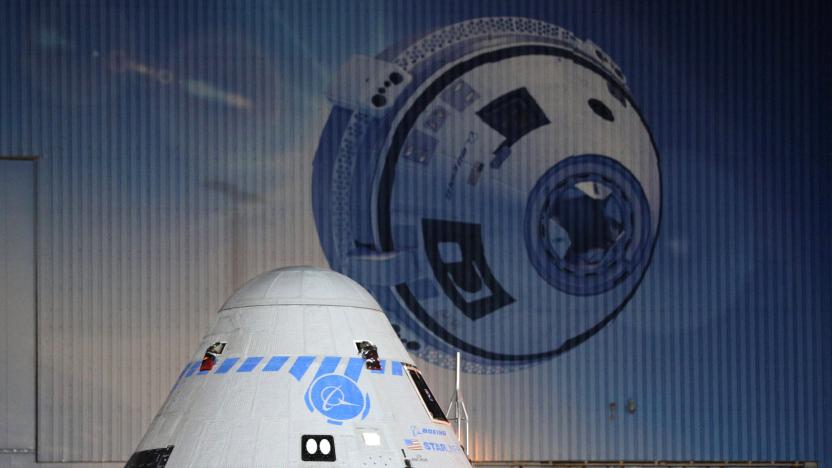 A close-up view of the CST-100 Starliner spacecraft while rolling out from Boeings Commercial Cargo and Processing Facility in the pre-dawn hours at the Kennedy Space Center in Cape Canaveral, Florida on July 17, 2021, ahead of its scheduled launch on July 30. (Photo by Gregg Newton / AFP) (Photo by GREGG NEWTON/AFP via Getty Images)