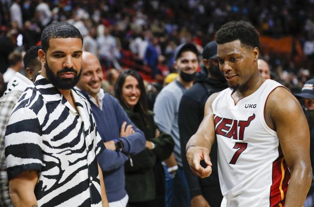 Jan 14, 2022; Miami, Florida, USA; Miami Heat guard Kyle Lowry (7) and Canadian rapper Drake talk after the game against the Atlanta Hawks at FTX Arena. Mandatory Credit: Sam Navarro-USA TODAY Sports