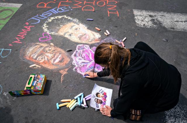 MINNEAPOLIS, MN - APRIL 18: People gather in George Floyd Square for an AAPI and Black solidarity rally on Sunday, April 18, 2021 in Minneapolis, MN. (Jason Armond / Los Angeles Times via Getty Images)