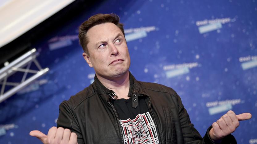 SpaceX owner and Tesla CEO Elon Musk arrives on the red carpet for the Axel Springer media award, in Berlin, Germany, Tuesday, Dec. 1, 2020. (Britta Pedersen/Pool via AP)