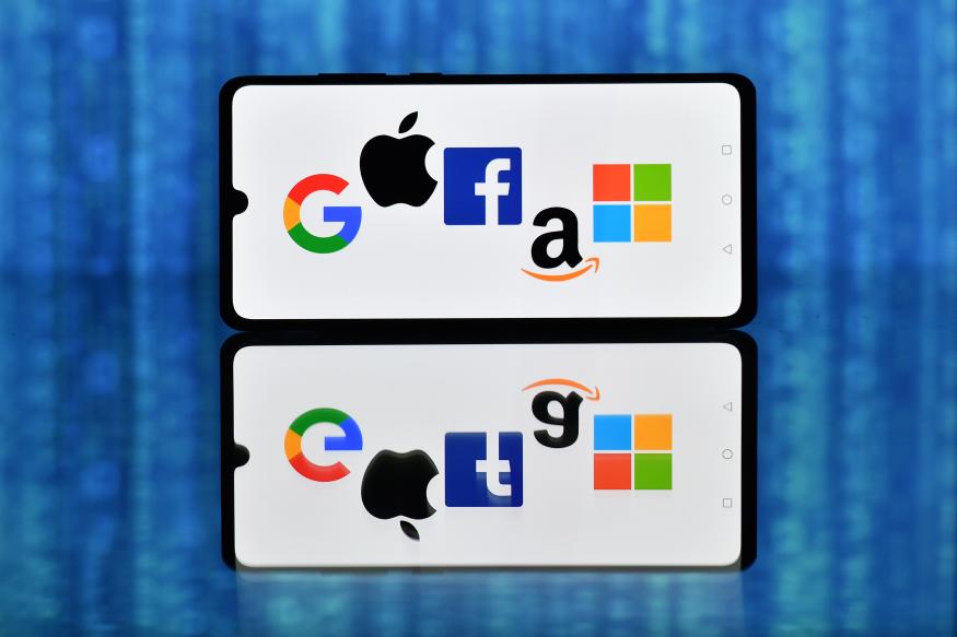 An illustration picture taken in London on December 18, 2020 shows the logos of Google, Apple, Facebook, Amazon and Microsoft displayed on a mobile phone. - Accelerating the transition to an ever more digital life, the coronavirus pandemic has tightened tech giants' grip on billions of customers' lives. (Photo by JUSTIN TALLIS / AFP) (Photo by JUSTIN TALLIS/AFP via Getty Images)