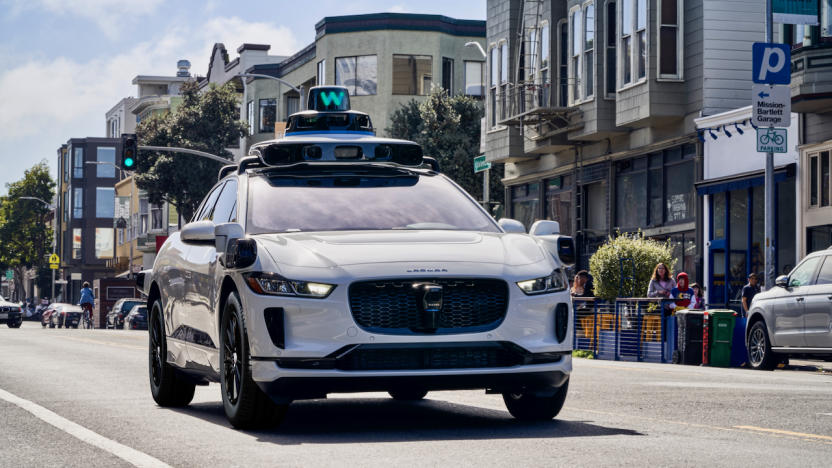 Waymo's autonomous vehicle driving on a street.                               