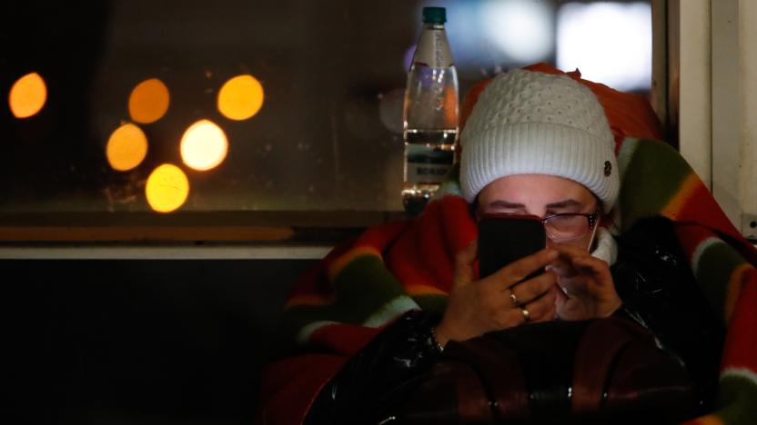 A elderly Ukrainian refugee uses her phone at the Warsaw West Bus Station (Dworzec Autobusowy Warszawa Zachodnia), as refugees from Ukraine wait to be transferred to other countries, following the Russian invasion of Ukraine, in Warsaw, Poland, on 5 March, 2022. Lithuania, Slovakia and other countries have been offering their assistance to refugees escaping from Ukraine, whilst some countries such as the US or UK have imposed sanctions on Russia. (Photo by Ceng Shou Yi/NurPhoto via Getty Images)