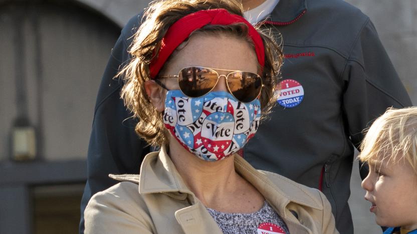 PHILADELPHIA, PA - OCTOBER 17:  Nya Nelson wears a "Vote" themed mask due to the coronavirus pandemic and an "I VOTED TODAY" sticker while departing with her family after casting their early voting ballots at Roxborough High School on October 17, 2020 in Philadelphia, Pennsylvania.  With the election only a little more than two weeks away, a new form of in-person early voting by using mail ballots, enables millions of voters have already cast their ballots.  President Donald Trump won the battleground state of Pennsylvania by only 44,000 votes in 2016, the first Republican to do so since President George Bush in 1988.  (Photo by Mark Makela/Getty Images)