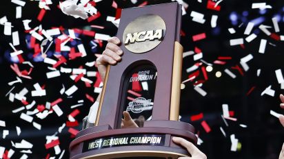 Getty Images - LOS ANGELES, CALIFORNIA - MARCH 30: Head coach Nate Oats of the Alabama Crimson Tide celebrates with the trophy after defeating the Clemson Tigers 89-82 in the Elite 8 round of the NCAA Men's Basketball Tournament at Crypto.com Arena on March 30, 2024 in Los Angeles, California. (Photo by Ronald Martinez/Getty Images)