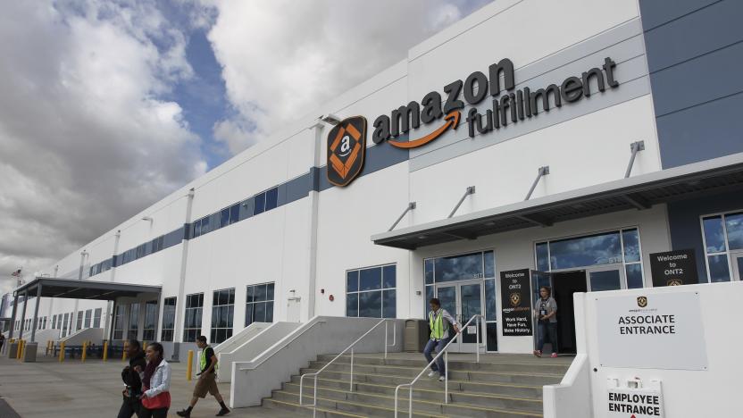 FILE - People leave the entrance to the Amazon San Bernardino Fulfillment Center, October 29, 2013 in San Bernardino, Calif. California has hit Amazon with two separate fines totaling $5.9 million, alleging the e-commerce giant violated a law designed to protect warehouse employees from requirements that they work so quickly that it risks their safety, officials said Tuesday, June 18, 2024. (AP Photo/David McNew, File)