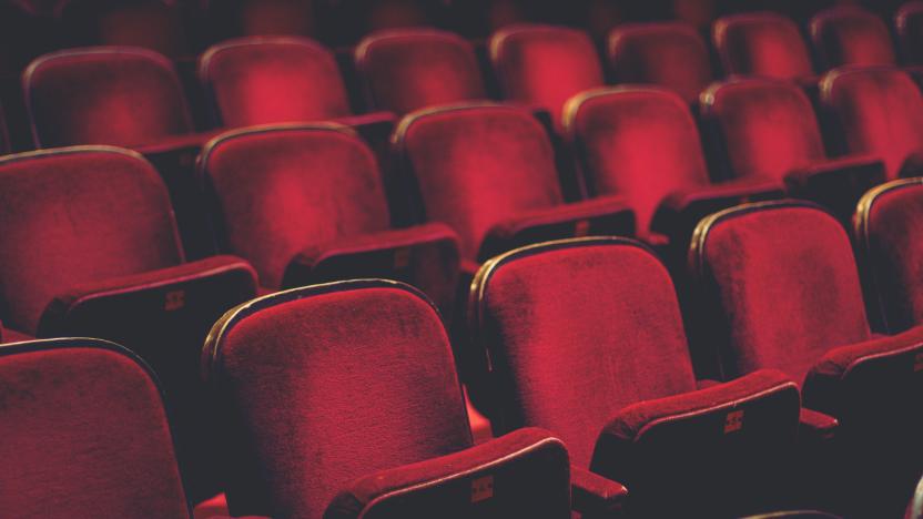 Empty comfortable red seats with numbers in cinema