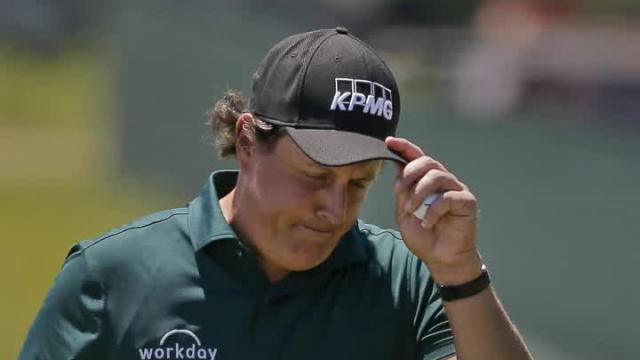 Phil Mickelson snaps and hits a ball before it had stopped rolling