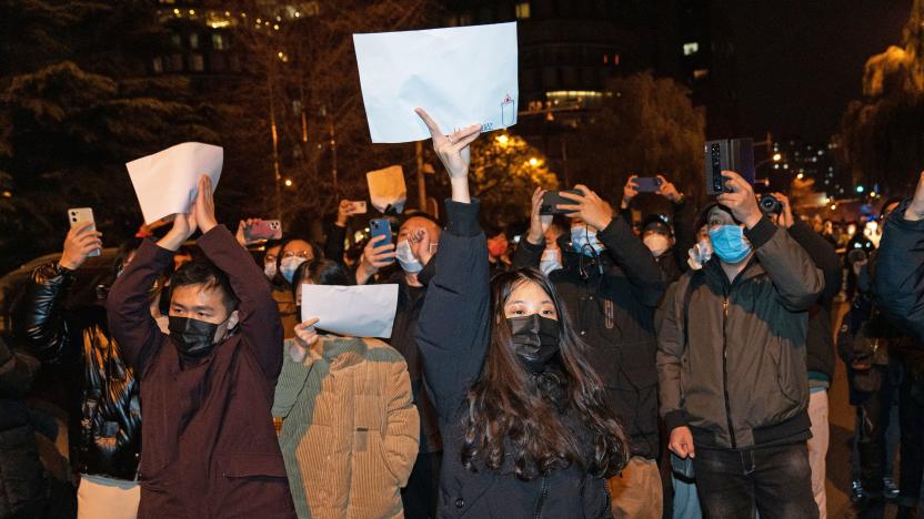 BEIJING, CHINA - NOVEMBER 27: Demonstrators hold white signs as a form of protest during a protest against Zero Covid and epidemic prevention restrictions in Beijing, China, on Sunday, November 27, 2022. (Photo by )