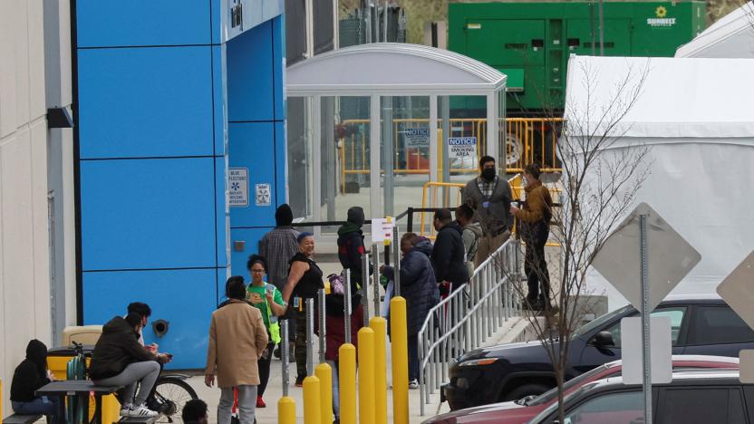 Amazon workers line up outside tents in the parking lot outside Amazon’s LDJ5 sortation center, as employees begin voting to unionize a second warehouse in the Staten Island borough of New York City, U.S. April 25, 2022. REUTERS/Brendan McDermid.