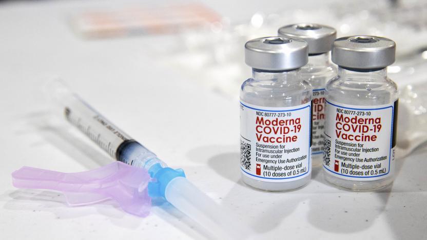 Vials of the Moderna COVID-19 vaccine are placed next to a loaded syringe at the Throop Civic Center in Throop, Pa. during a clinic on Saturday, Jan. 9, 2021. The Lackawanna County Medical Society had about 400 doses of the Moderna vaccine on hand to administer to those in the Phase 1A group of Pennsylvania's vaccine rollout plan, which is limited to healthcare personnel and long-term care facility residents. (Christopher Dolan/The Times-Tribune via AP)