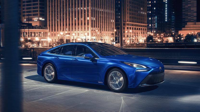 The 2021 Toyota Mirai fuel-cell vehicle cruising through a city environment.