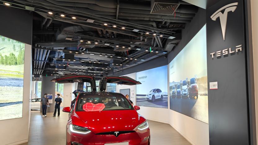 SHANGHAI, CHINA - MAY 23, 2023 - Customers experience a Tesla electric car at a Tesla store in Shanghai, China, May 23, 2023. Tesla will sell its Chinese-made Model 3 and Model Y cars in Canada, according to the company's website, confirming that the electric carmaker has completed its first shipments to North America from its factory in Shanghai. (Photo credit should read CFOTO/Future Publishing via Getty Images)