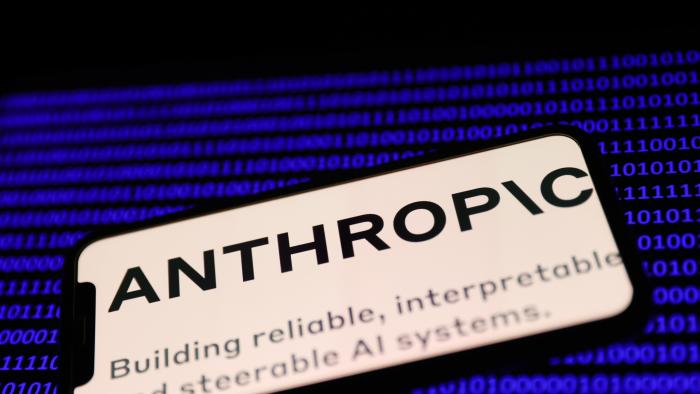 Anthropic logo displayed on a phone screen and a binery code displayed on a laptop screen are seen in this illustration photo taken in Krakow, Poland on February 7, 2023. (Photo by Jakub Porzycki/NurPhoto via Getty Images)