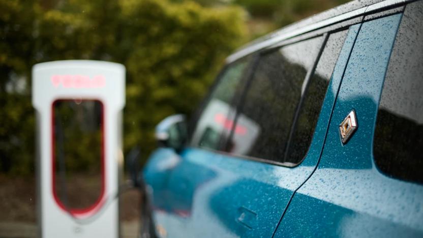 A Rivian EV parked at a charging station. 