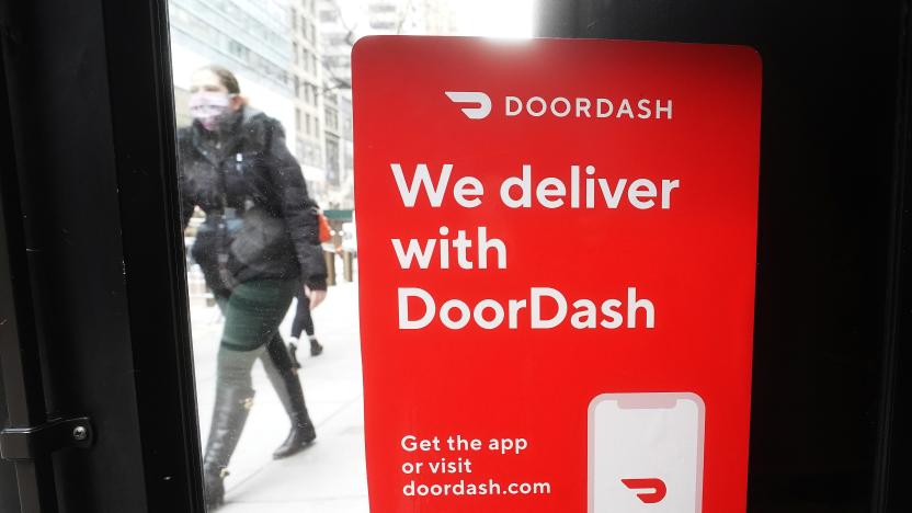 A DoorDash sign is pictured on a restaurant on the day they hold their IPO in the Manhattan borough of New York City, New York, U.S., December 9, 2020. REUTERS/Carlo Allegri