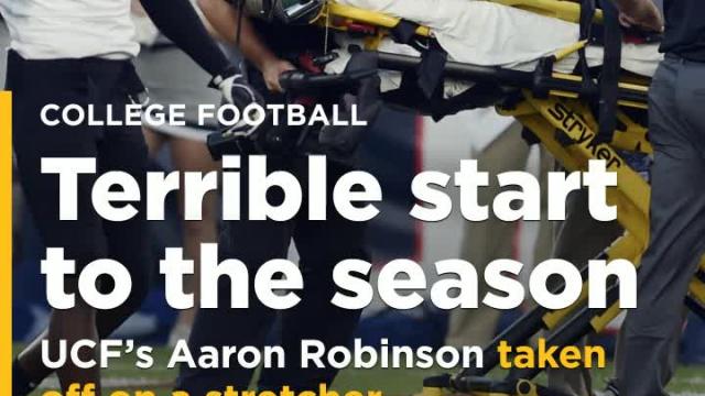 UCF CB Aaron Robinson stretchered off the field after opening kickoff