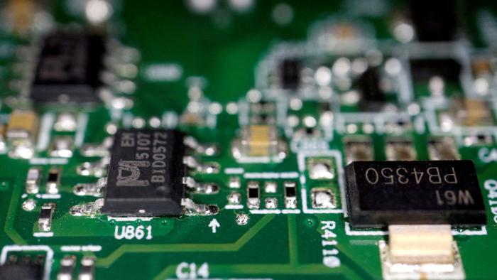 FILE PHOTO: FILE PHOTO: Semiconductor chips are seen on a printed circuit board in this illustration picture taken February 17, 2023. REUTERS/Florence Lo/Illustration/File Photo/File Photo