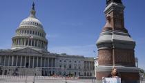 Jennifer Gay, a TikTok content creator, sits outside the U.S. Capitol, Tuesday, April 23, 2024, in Washington as Senators prepare to consider legislation that would force TikTok’s China-based parent company to sell the social media platform under the threat of a ban, a contentious move by U.S. lawmakers. (AP Photo/Mariam Zuhaib)