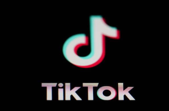 FILE - The icon for the video sharing TikTok app is seen on a smartphone, Tuesday, Feb. 28, 2023, in Marple Township, Pa. A former TikTok executive is alleging she was retaliated against and fired from her position because the company’s China-based owners determined she “lacked the docility and meekness” required of female employees, Friday, Feb. 9, 2024. (AP Photo/Matt Slocum, File)