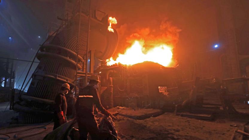 Iraqi steelworkers and a forge.